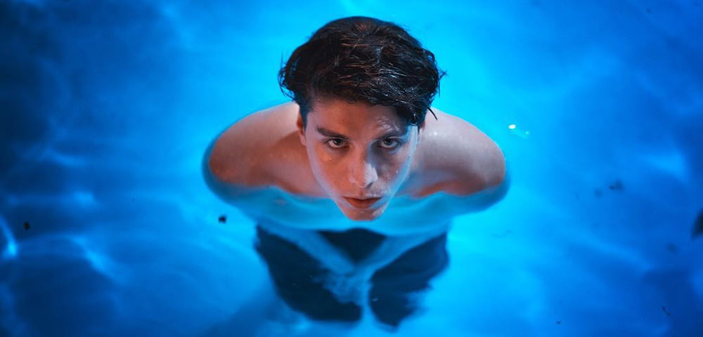 White Lotus Star Lukas Gage’s Viral Response To Twitter User Who Criticised Him Over Taking Gay Roles