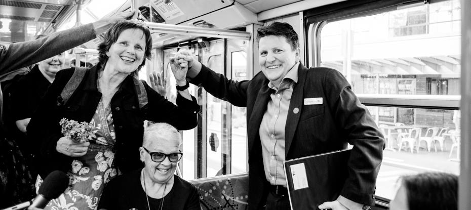 Women held hands on a tram to mark a lesbian couple that were convicted in 1977
