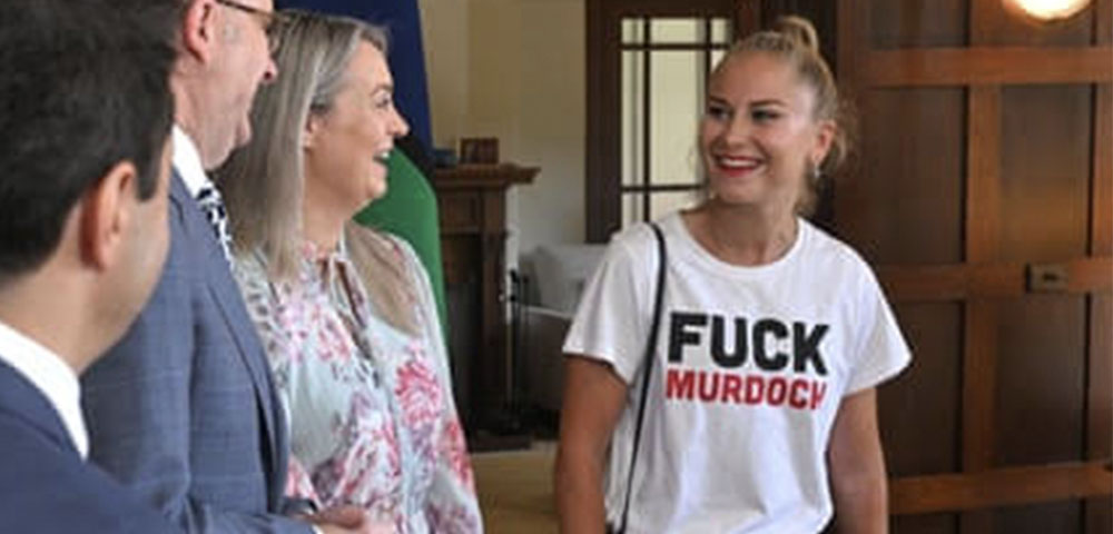 Outrage As Grace Tame Wears Anti-Murdoch Shirt During PM Visit